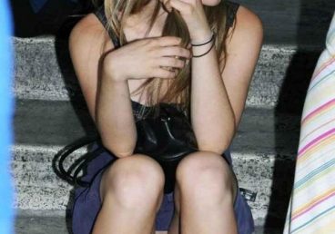 schoolgirl sitting on the stairs with no panties having a pussy oops upskirt moment