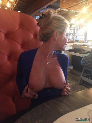 Risky tits out MILF in public flashing restaurant