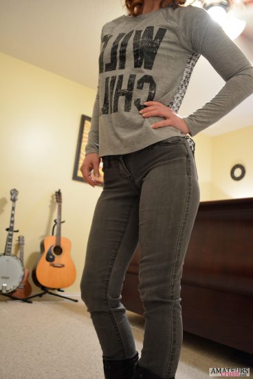 Hot wife undressing in her warchild shirt and black jeans