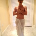 Topless Kaley covering her tits FI