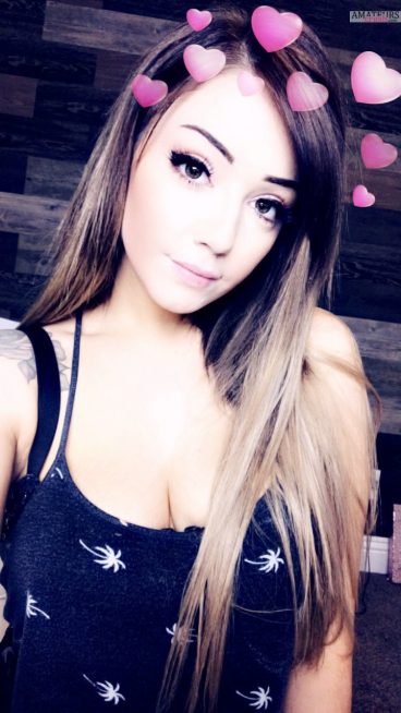 Cute girl in black top with hearts filter on